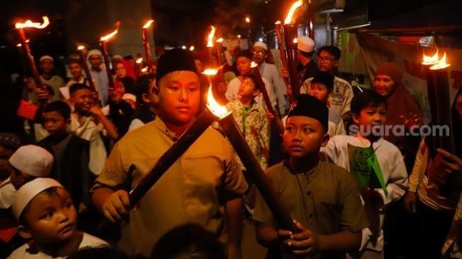 Torch carnival marked Islam's New Year at Menteng, Jakarta [Suara.com/Alfian Winanto]